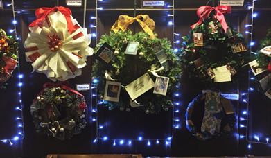 Image shows a variety of festive wreaths.