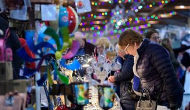 Lady shopping at a stall