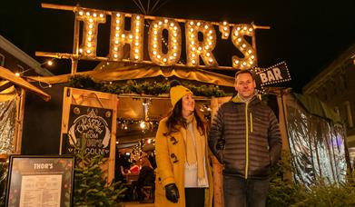 Couple at the entrance of Thor's Tipi in the Cornhill