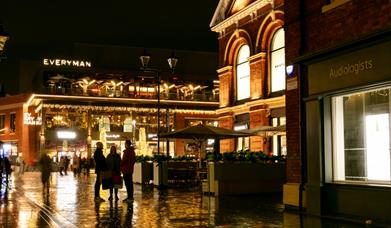 A view of Lincoln's Cornhill Quarter at Christmas, illuminated with golden lights