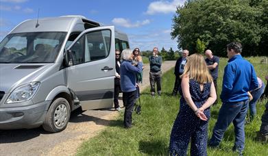 A group of people standing next to a van at Wilder Doddington